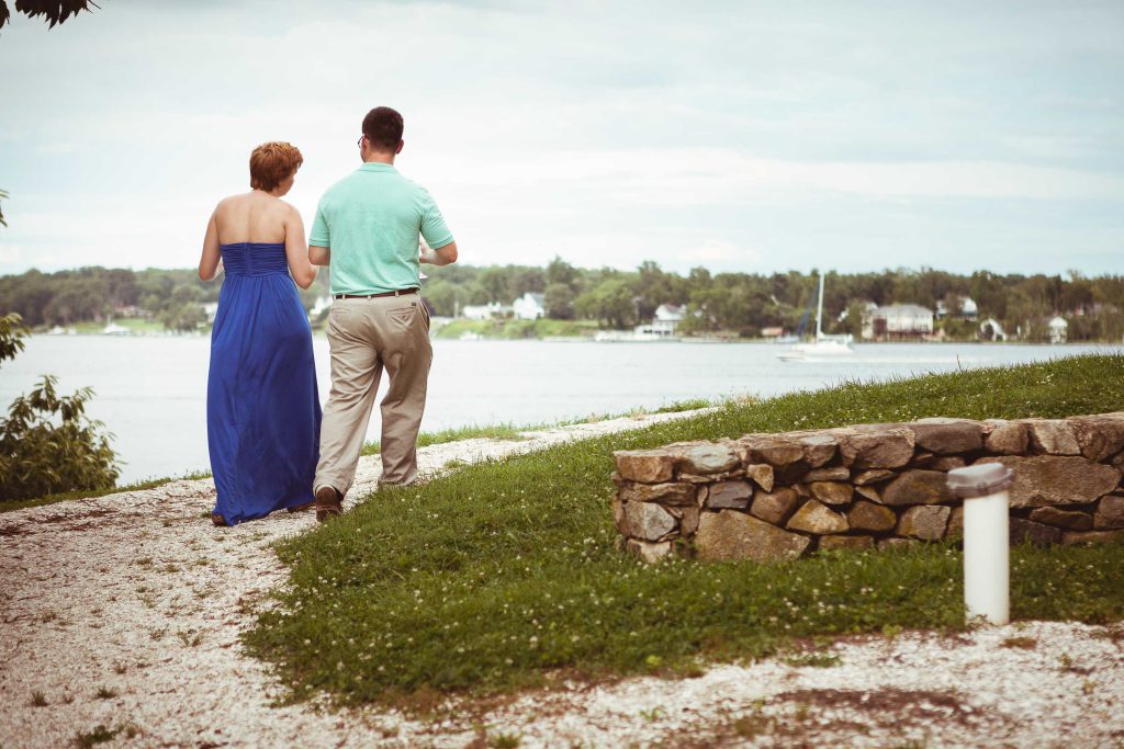 A couple strolls along a scenic path near the water in Historic London Town, Maryland.