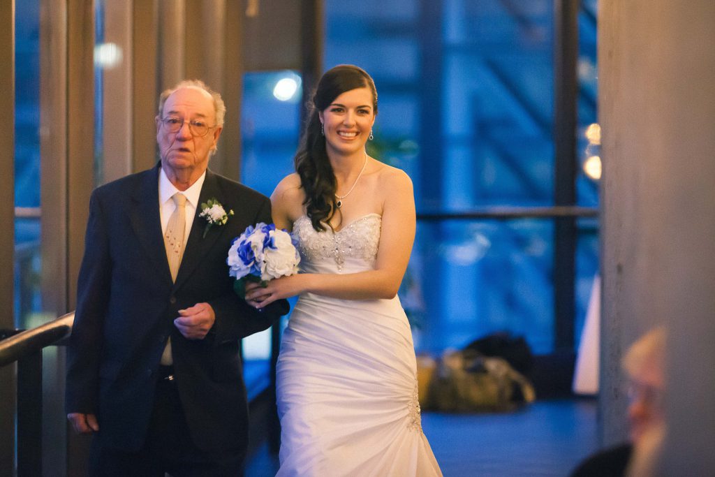 A bride walking down the aisle at a wedding in Baltimore.