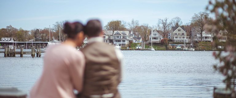 A couple admiring the waterfront view in Annapolis, Maryland.