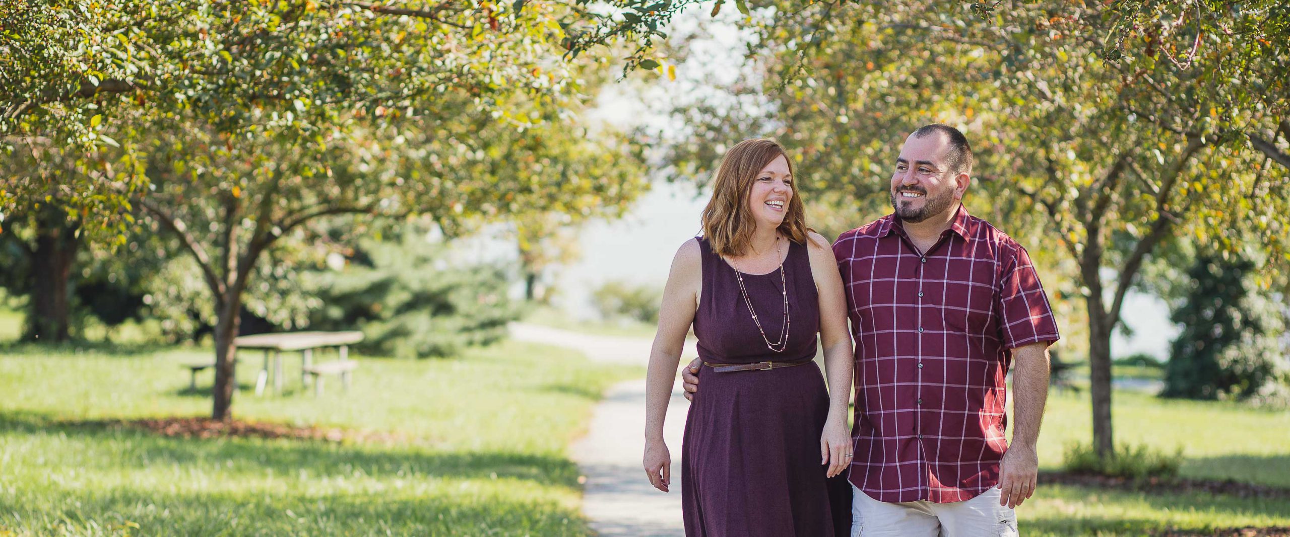 A man and woman are walking down a path in Baltimore.