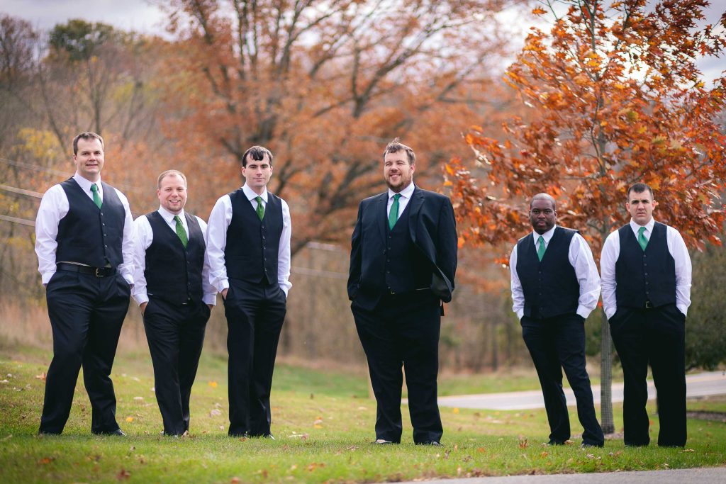 A group of groomsmen posing in front of a tree in Germantown, Maryland.