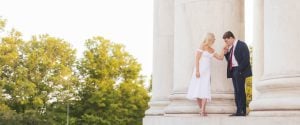 A couple kissing on the steps of the Jefferson Memorial in Washington DC.