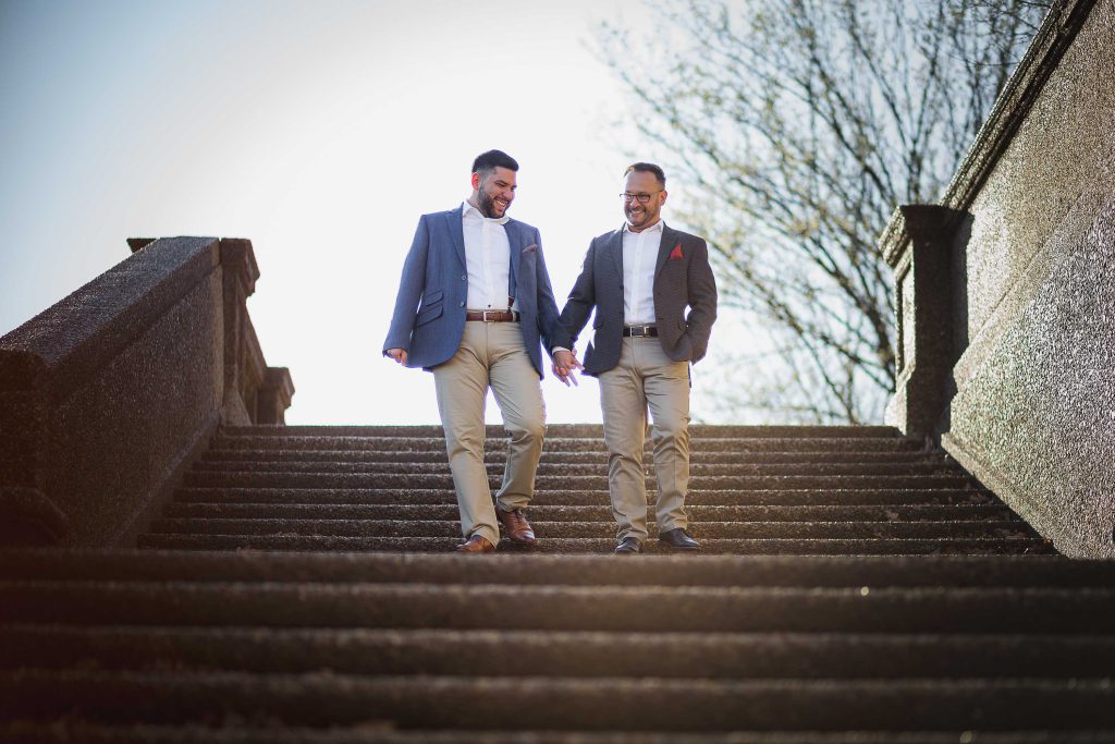 Two men in suits walking down a set of stairs in Washington DC.