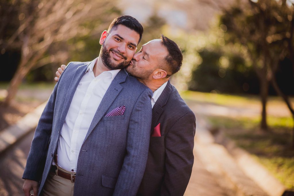 Two men hugging in Meridian Hill Park, Washington DC.