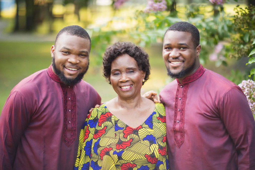 Three African women posing for a photo in Watkins Park.