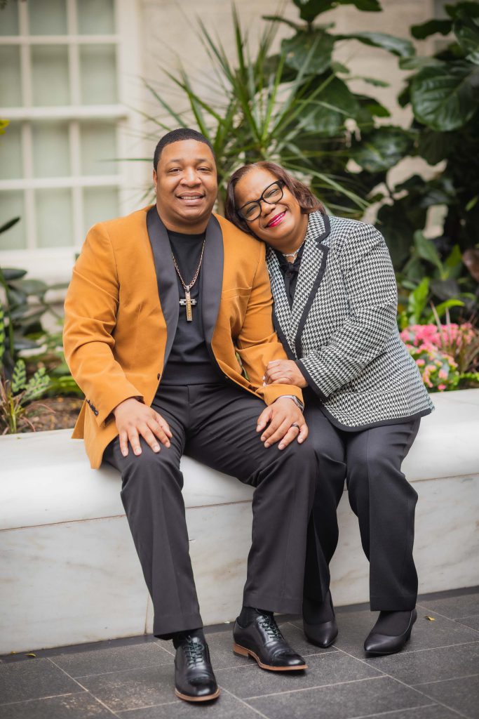 A man and a woman posing for a photo in the National Portraits Gallery.