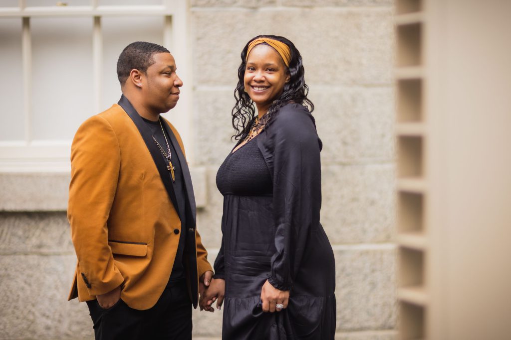 A man and woman standing next to each other in front of the National Portraits Gallery.