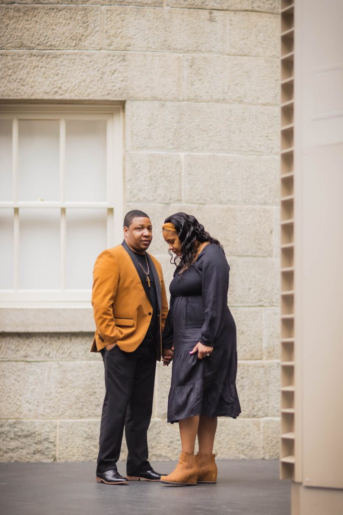 A couple standing in front of the National Portraits Gallery building.