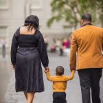 A family walking down a city street.