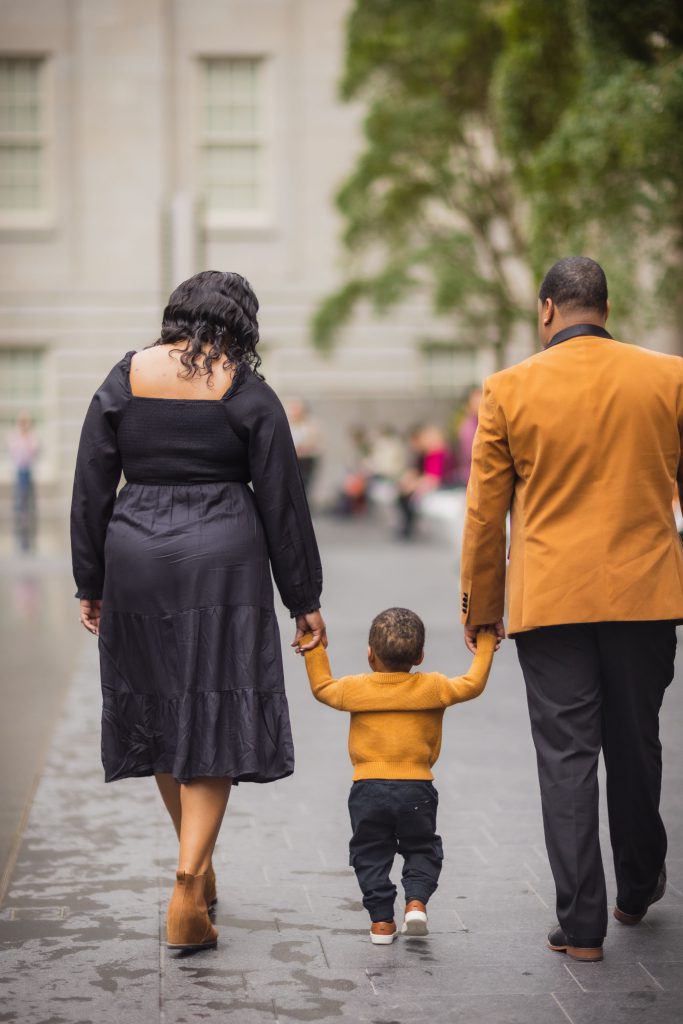 A family walking down a city street.