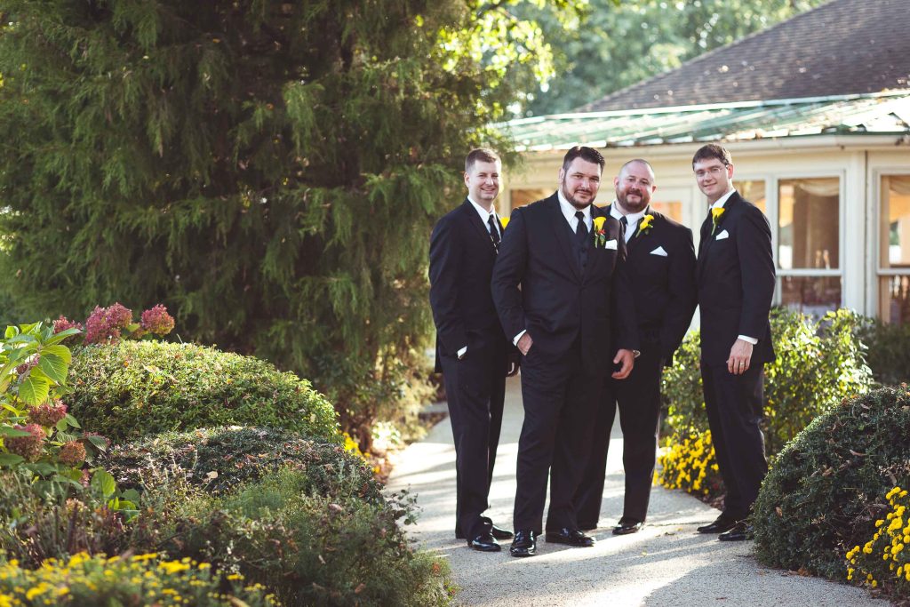 A group of groomsmen posing for a picture at Kent Island Resort in Maryland.