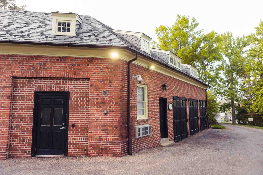 A brick building with black doors in Maryland.
