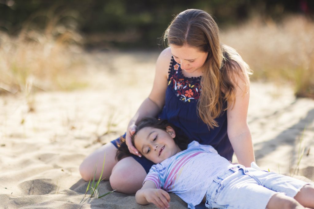 A family lounging on the sandy shores of Chesapeake Bay in Maryland.