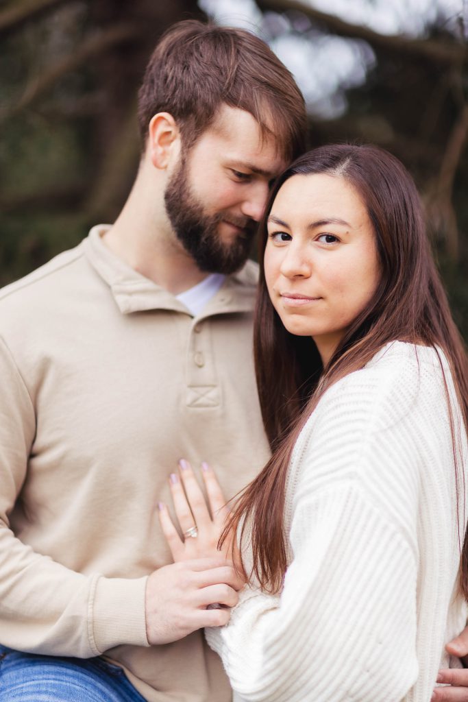 An old Ellicott City couple embracing each other during their engagement session, capturing a beautiful engagement photo.