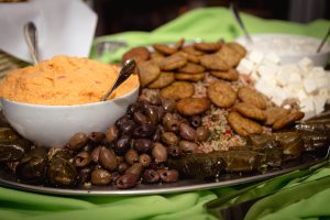 A platter of food on a table provided by Spilled Milk Catering.