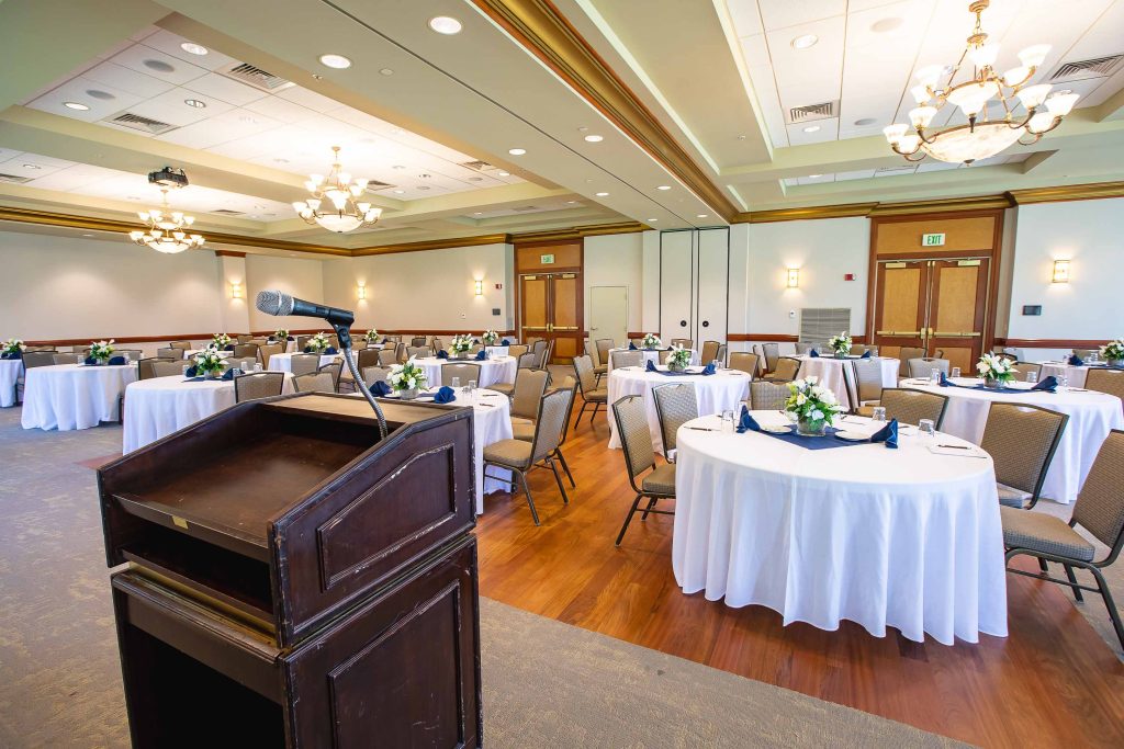 A large room with tables and chairs set up at Turf Valley Resort in Ellicott City, Maryland.