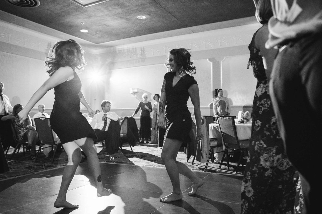 A black and white photo of two women dancing at a wedding in Maryland.