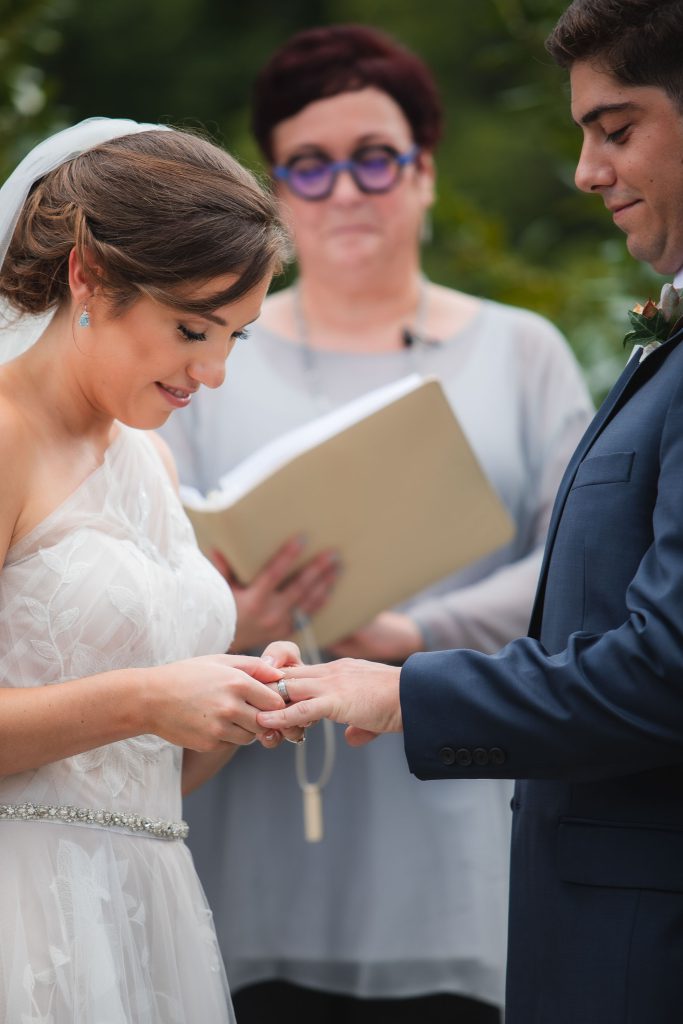 A woman wearing a wedding dress at Fleetwood Farm Winery, preparing for her wedding ceremony.