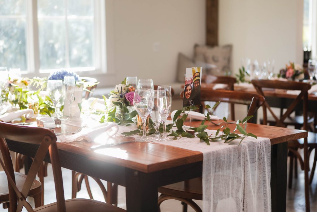 A wedding reception table set up with attention to detail at Fleetwood Farm Winery.