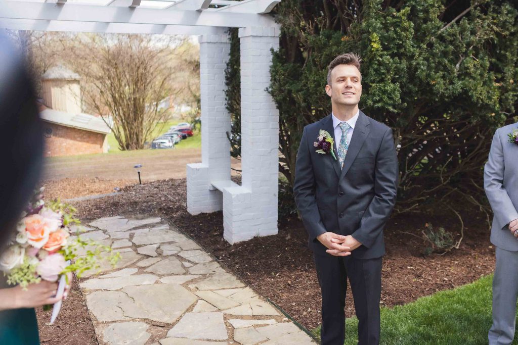 A couple exchanges loving glances during their wedding ceremony.