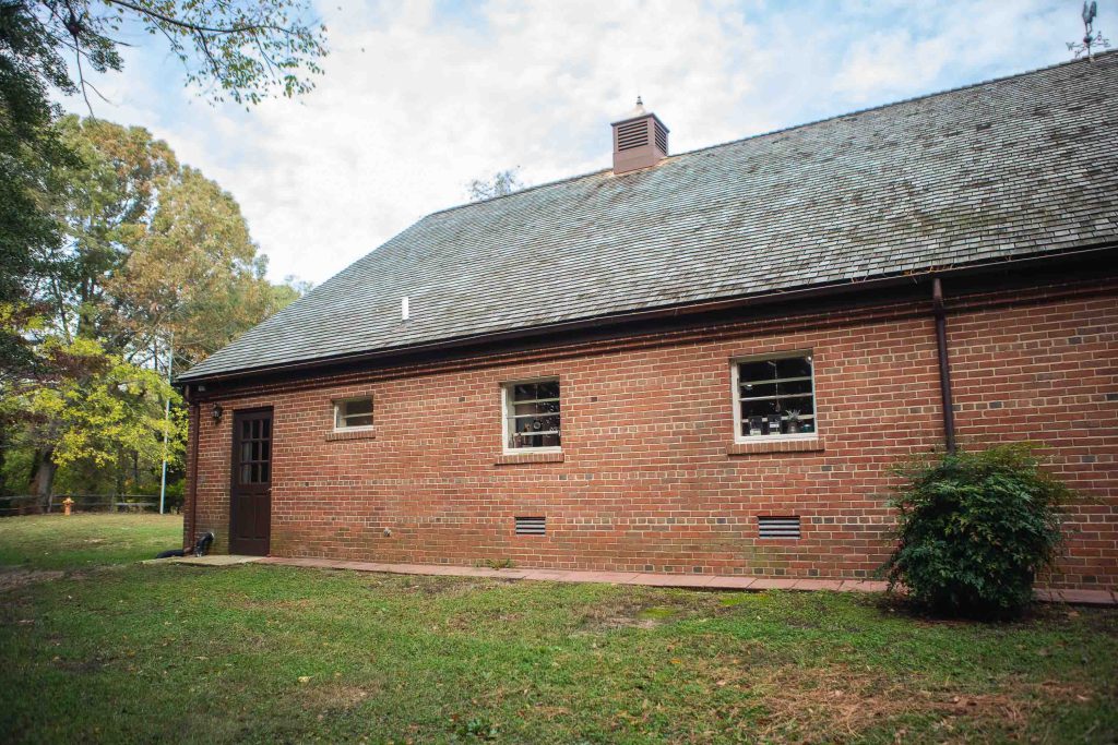 A building with windows and a roof, adorned with intricate details, perfect for a wedding.