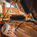 A candid grand piano in a church.