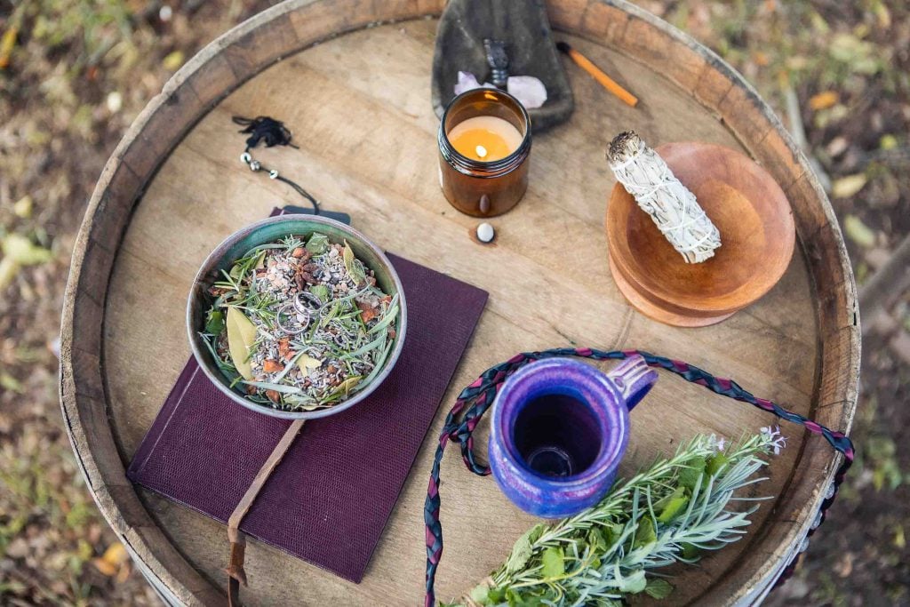 A detailed wooden barrel with a book on it.