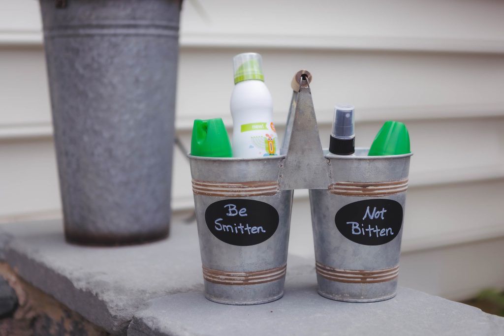 A collection of metal buckets showcasing various wedding details.