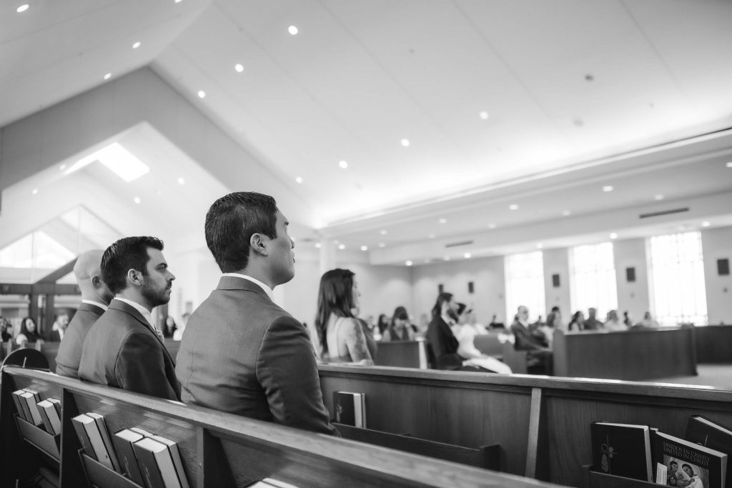 A black and white photo of a wedding ceremony.