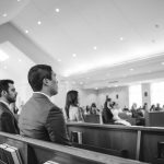 A black and white photo of a wedding ceremony.