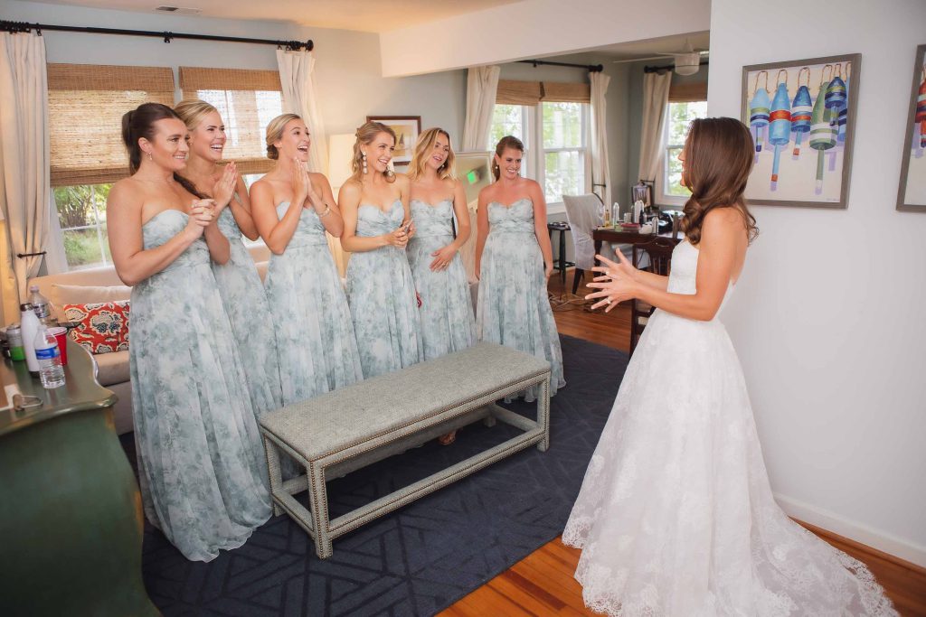A wedding party is preparing in a room for the event.