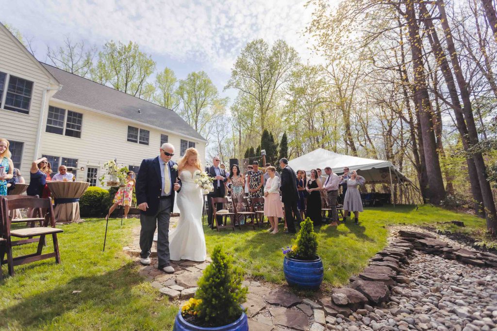A couple's wedding ceremony at an outdoor venue.