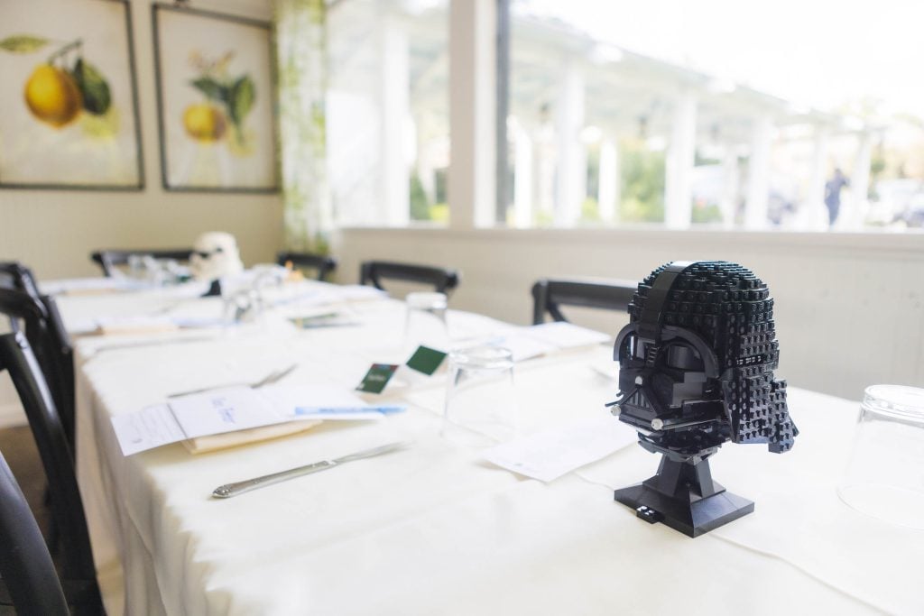 A table with a LEGO Darth Vader head, perfect for wedding decor.