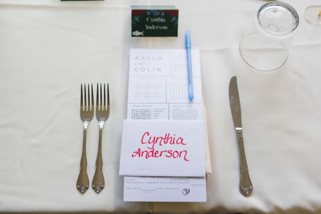 A detailed table setting for a wedding with a knife, fork, and napkin.