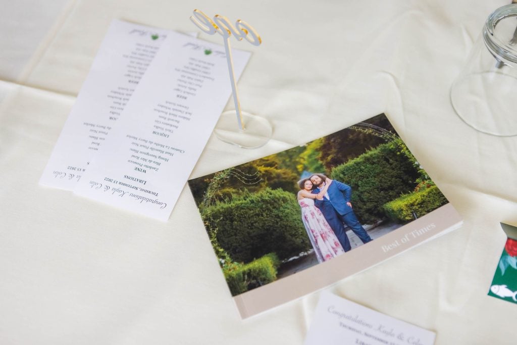 A wedding program with a photo of the bride and groom. - Details