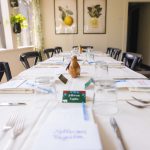 A table is set up with details for a dinner party.