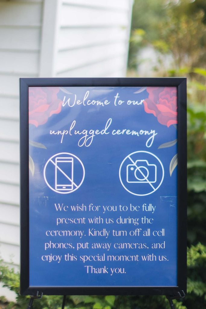A wedding sign with welcome details to our engaged ceremony.