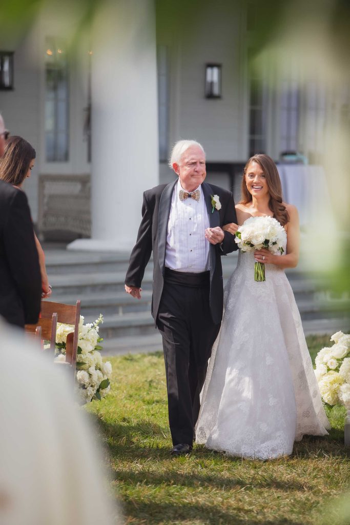A bride walks down the aisle at the wedding ceremony.