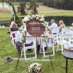 An outdoor wedding ceremony with charming details.