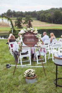An outdoor wedding ceremony with charming details.