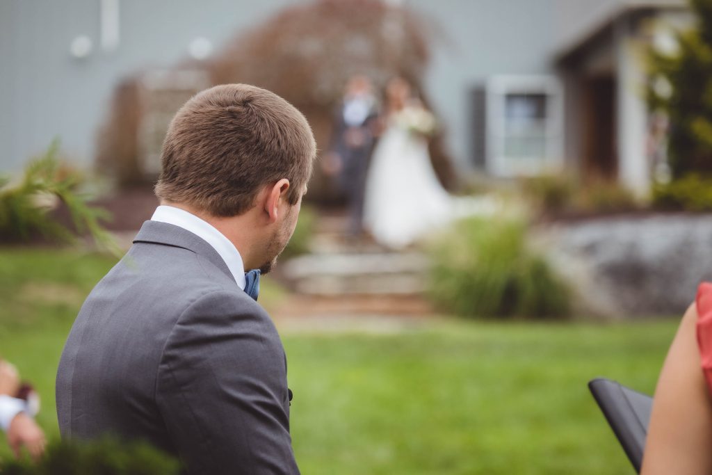 A couple exchanging glances during their wedding ceremony.