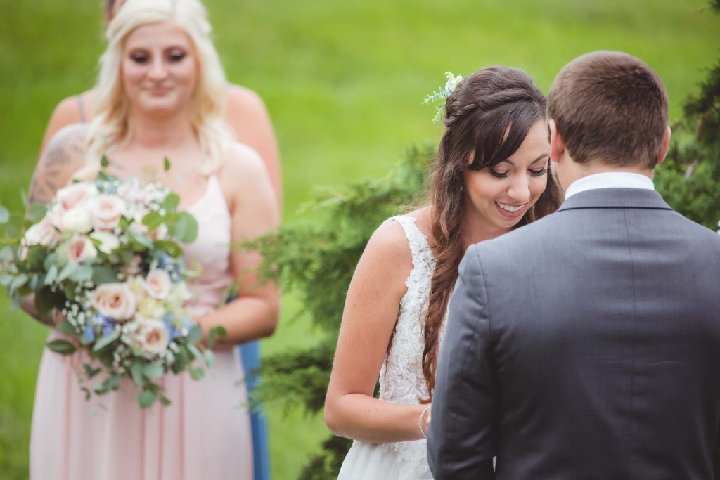 A couple gazes at each other during their wedding ceremony.