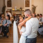 A couple's first dance at their wedding reception.
