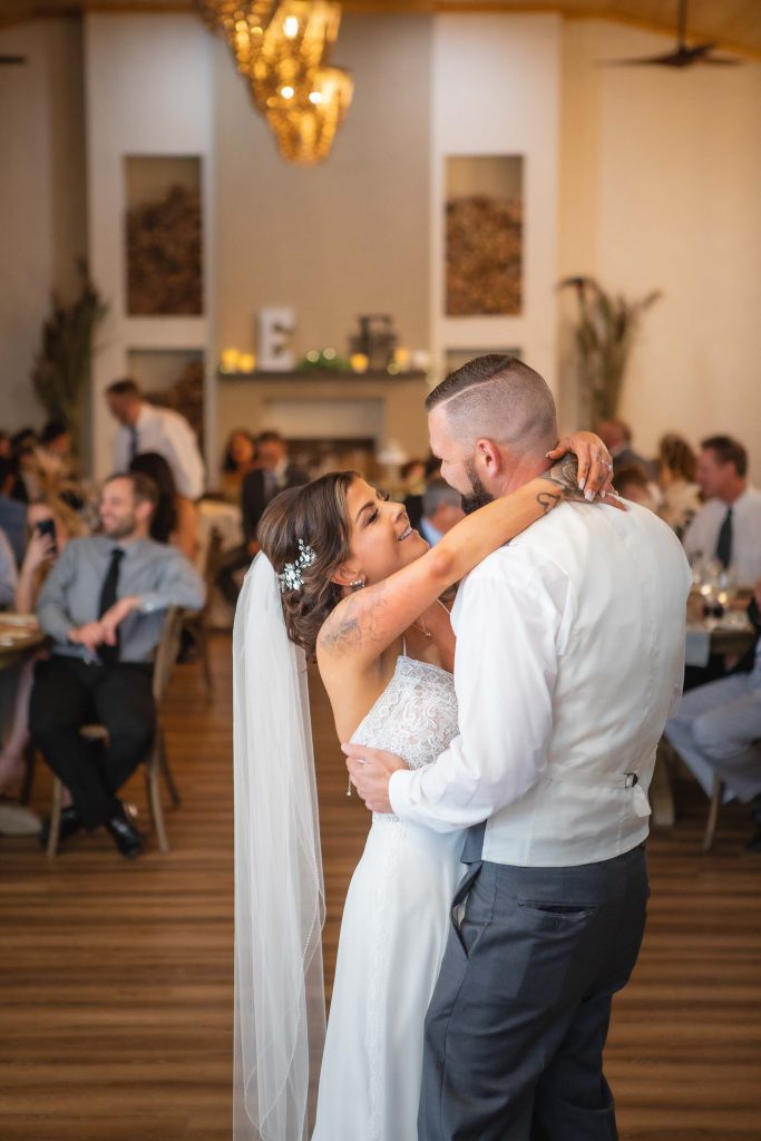 A couple's first dance at their wedding reception.
