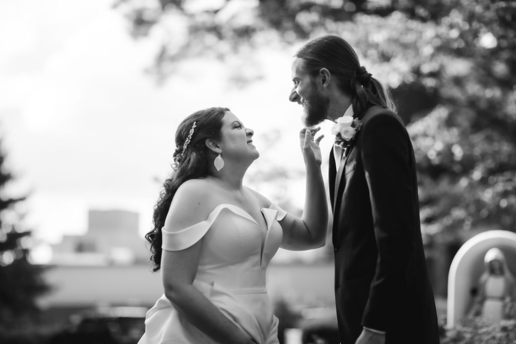 Black and white wedding portrait of bride and groom.