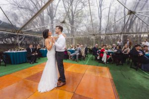A wedding couple sharing their first dance at the reception.
