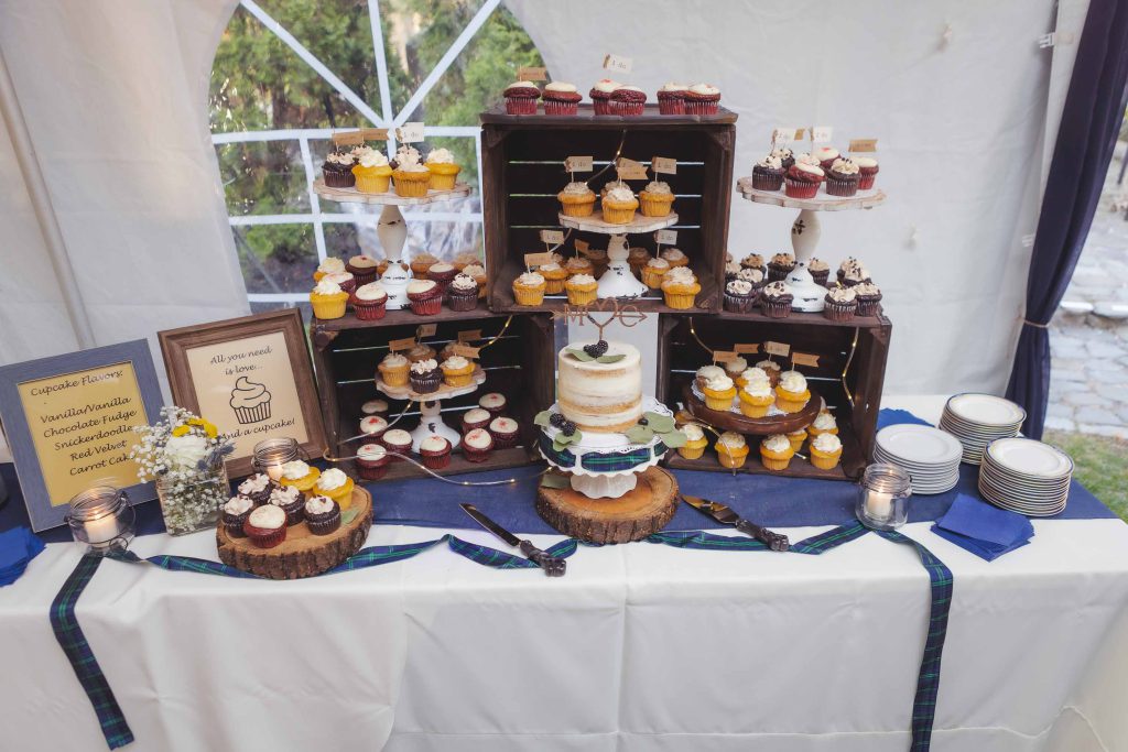 A table with wedding cupcakes.