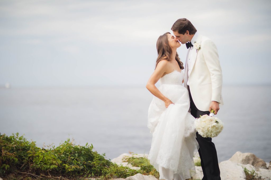 A wedding couple portrait by the ocean.