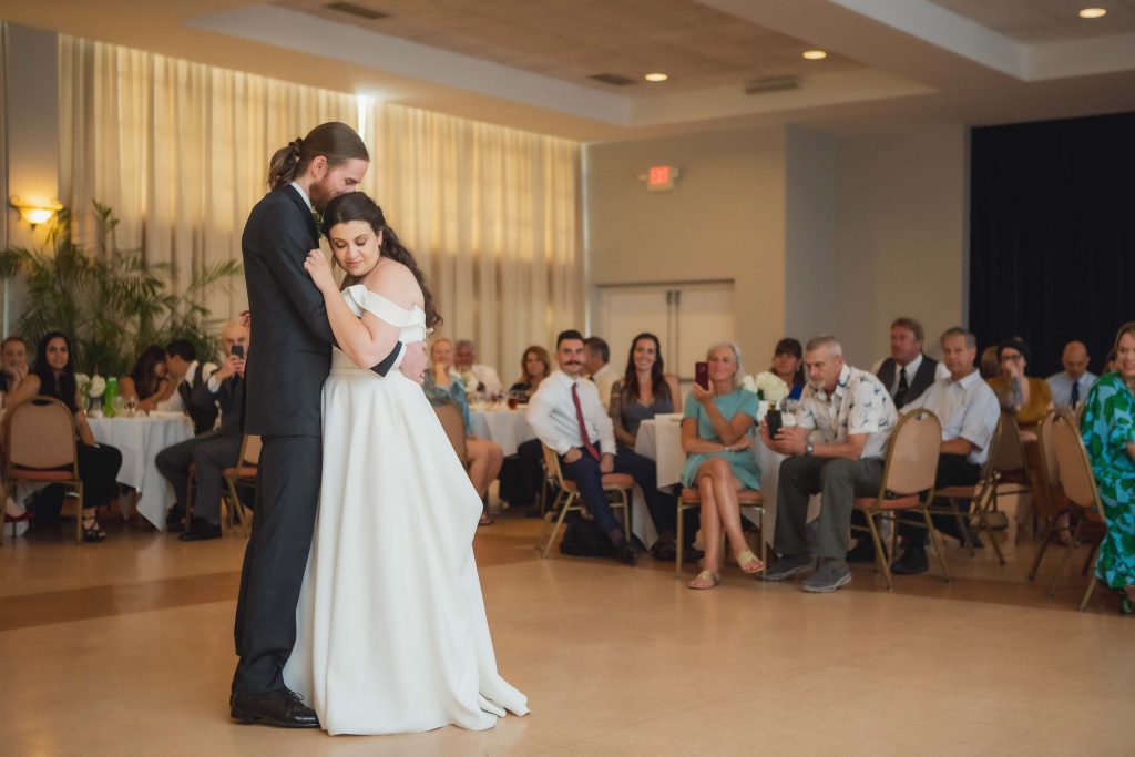 A couple's first dance at their wedding reception.