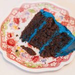 A detailed chocolate cake displayed on a plate.